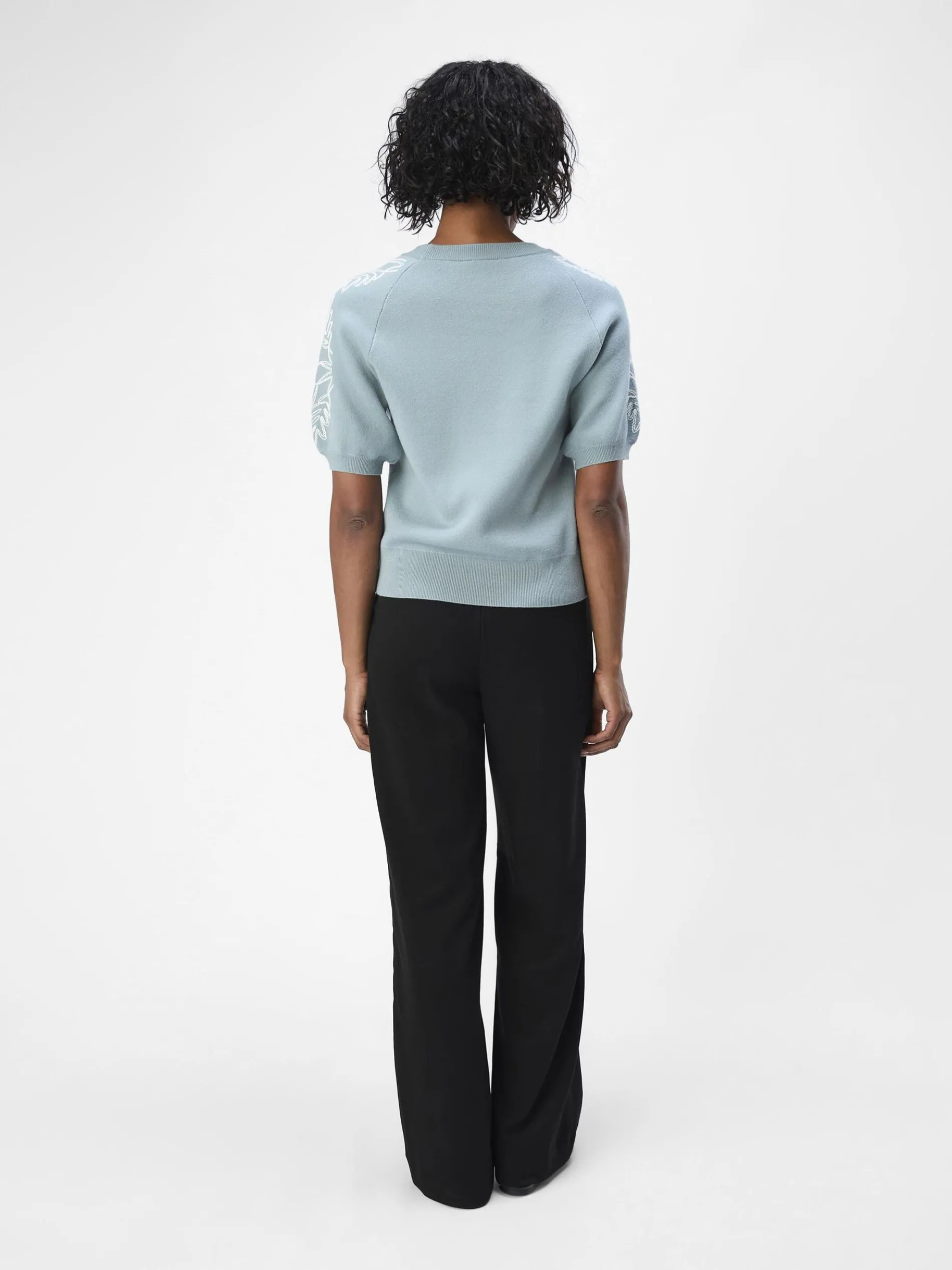 GEBORDUURD GEBREIDE TOP